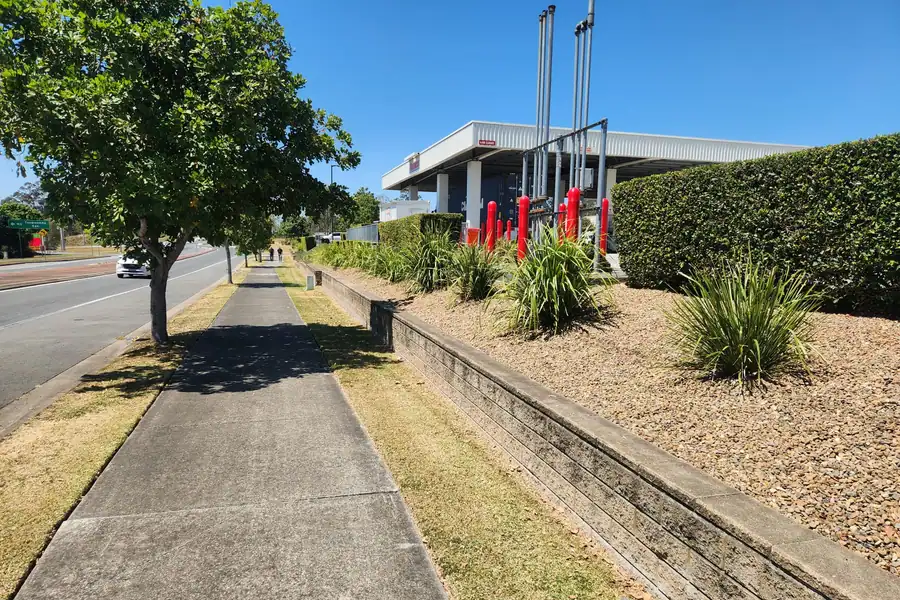Pruned shrubs and swept pathways